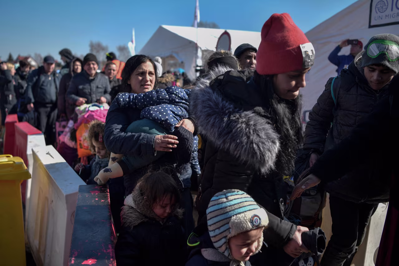 People cross the Ukrainian border in Medyka, eastern Poland, on March 11, 2022.