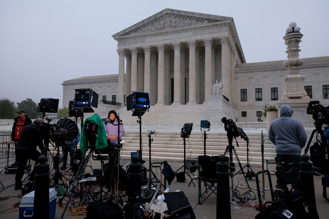 TV camera crews are positioned in front of the US Supreme Court in Washington, DC, on May 3.