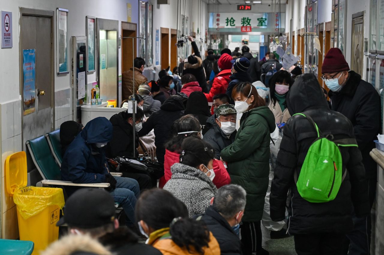 People wearing face masks wait for medical attention at Wuhan Red Cross Hospital in Wuhan on?Saturday