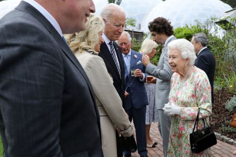Britain's Queen Elizabeth II mingles with US President Joe Biden and US first lady Jill Biden during a reception at The Eden Project in south west England on June 11.