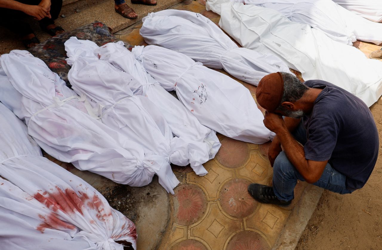 Mourners react next to the bodies of Palestinians killed in Israeli strikes in Khan Younis, Gaza, on Tuesday.