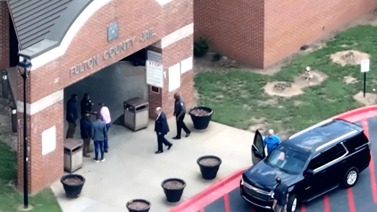 Rudy Giuliani enters Fulton County jail, on August 23.