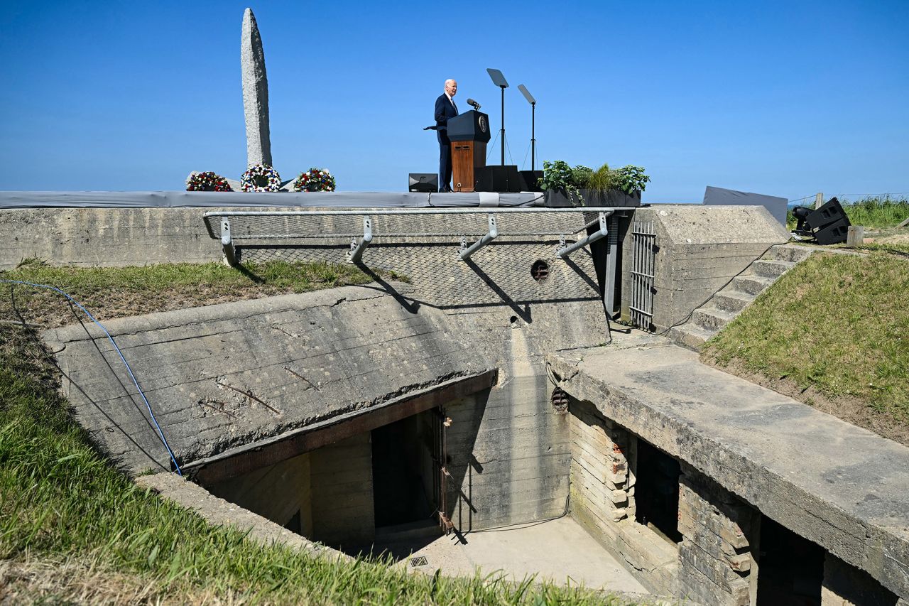 US President Joe Biden delivers a speech next to a monument atop a WWII-era German bunker on Pointe du Hoc clifftop in Cricqueville-en-Bessin, France, on June 7.