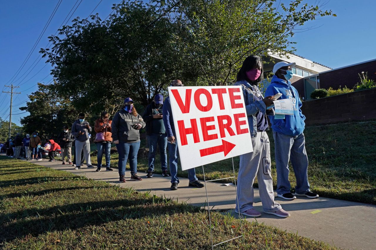 Early voters line up to cast their ballots at the South Regional Library polling location on October 15 in Durham, North Carolina.