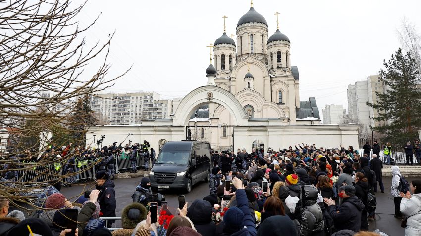 The hearse carrying Alexey Navalny's casket is parked outside the Church of the Icon of the Mother of God 'Quench My Sorrows' in Moscow before the funeral service on Friday.