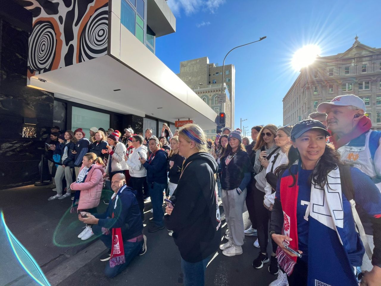 Fans wait for the US players at their hotel in Auckland.