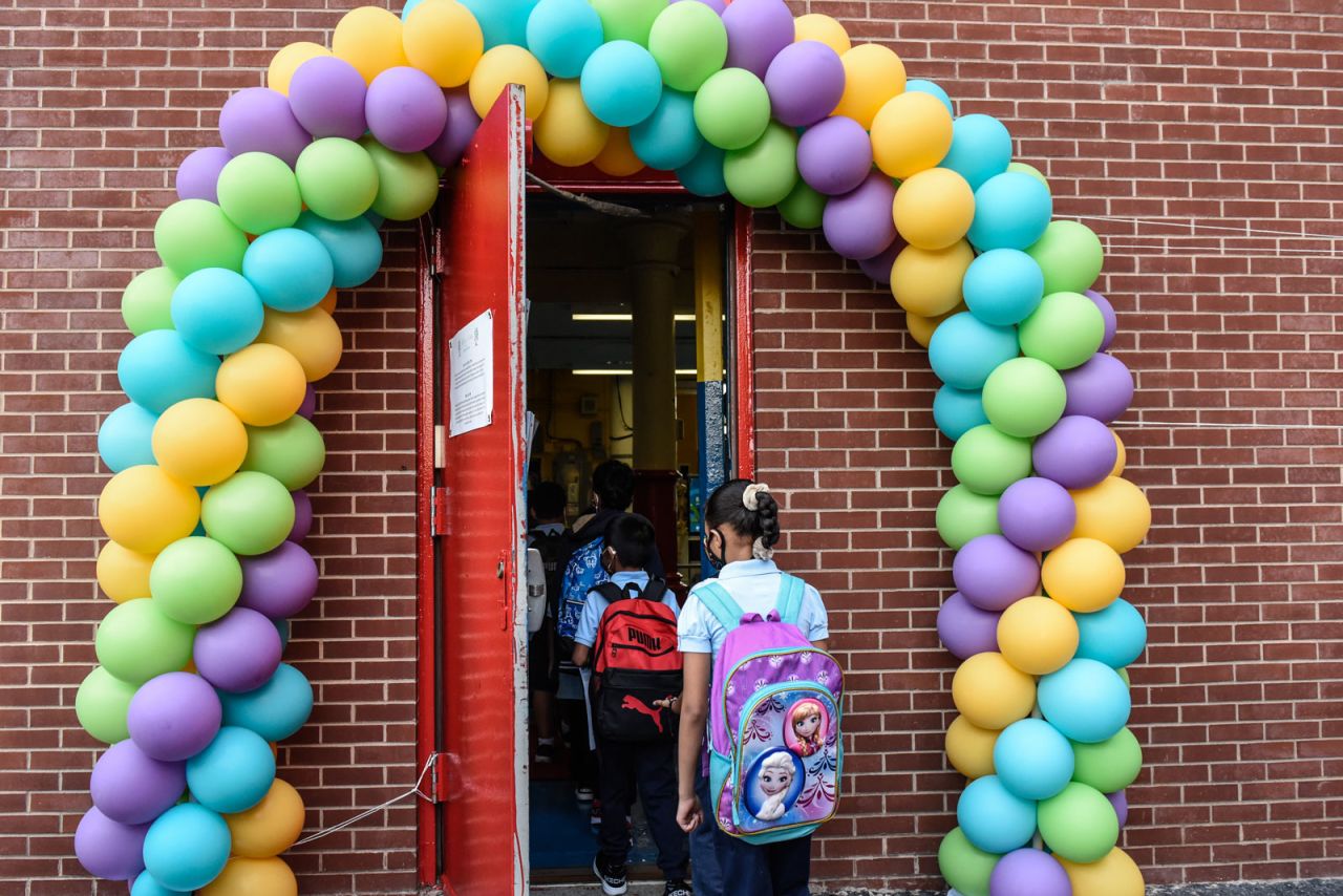 Students arrive on the first day of classes at a public school in the Bronx, New York on Sept. 13.