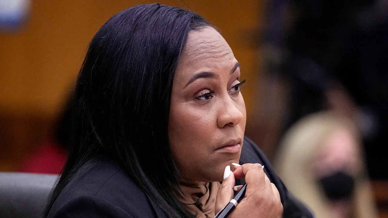 Fulton County District Attorney Fani Willis watches proceedings during a hearing to decide if the final report by a special grand jury looking into possible interference in the 2020 presidential election can be released on January 24 in Atlanta. 