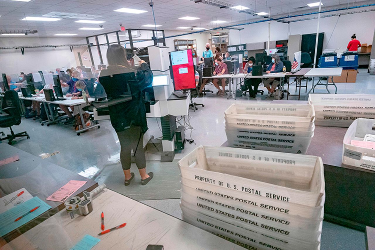 Poll workers count ballots inside the Maricopa County Election Department in Phoenix, Arizona on Thursday, November 5. 