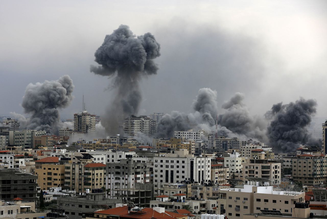 Smoke rises over buildings as the Israeli airstrikes continue in Gaza City, Gaza, on October 9.