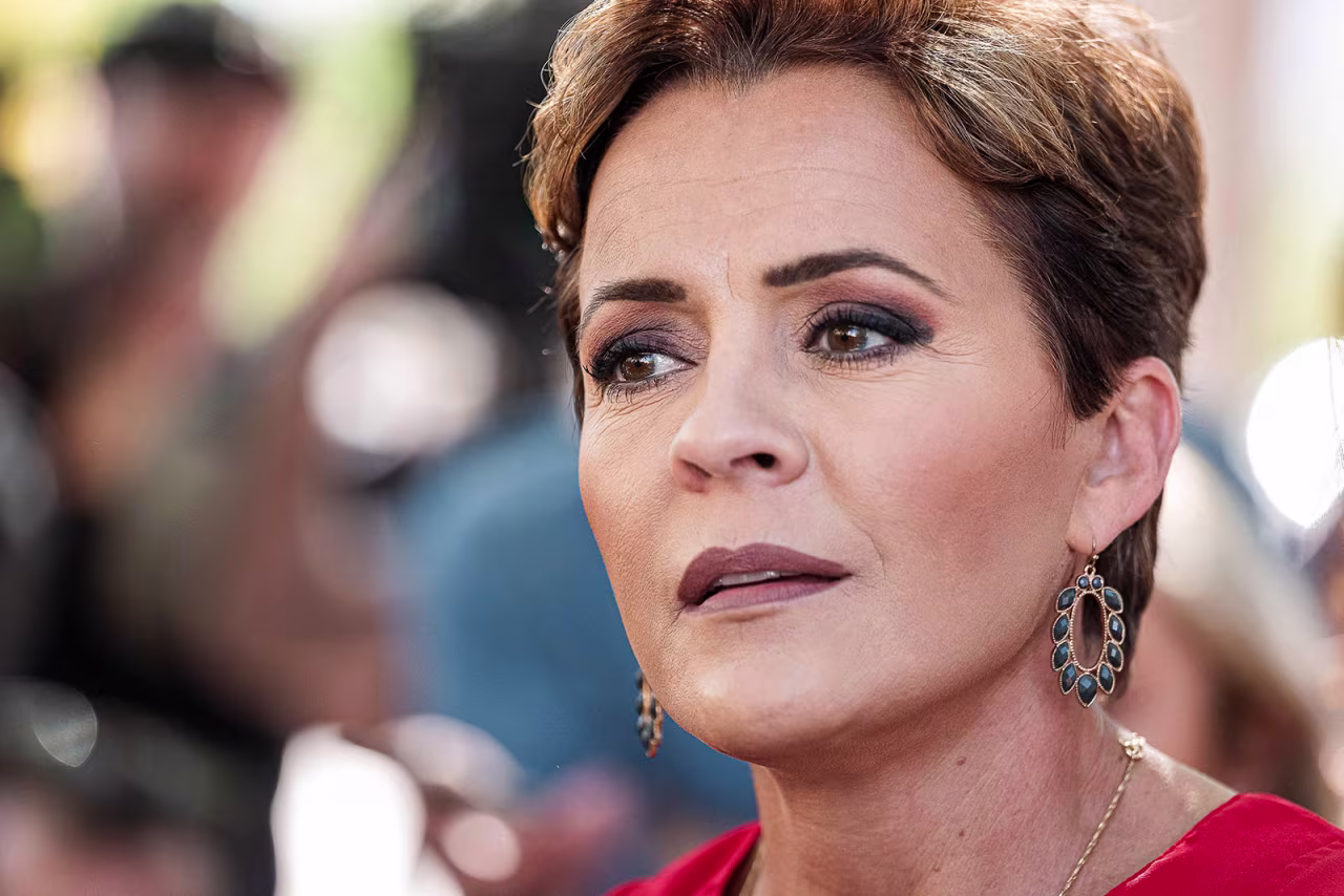 Kari Lake speaks to members of the media after voting in the midterm election in Phoenix on November 8. 