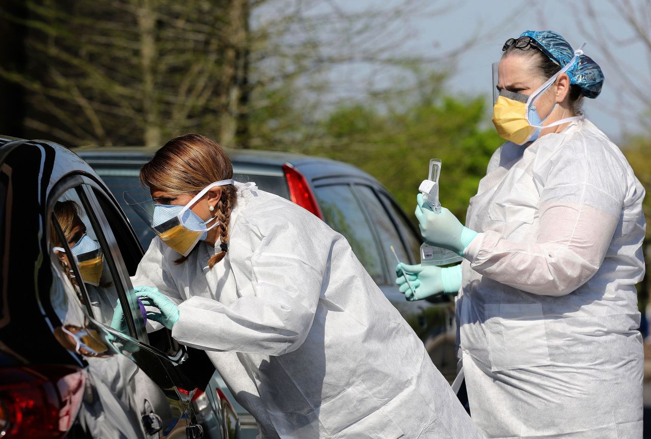 Nurses administer coronavirus tests at New Life Church in Little Rock, Arkansas on April 1.