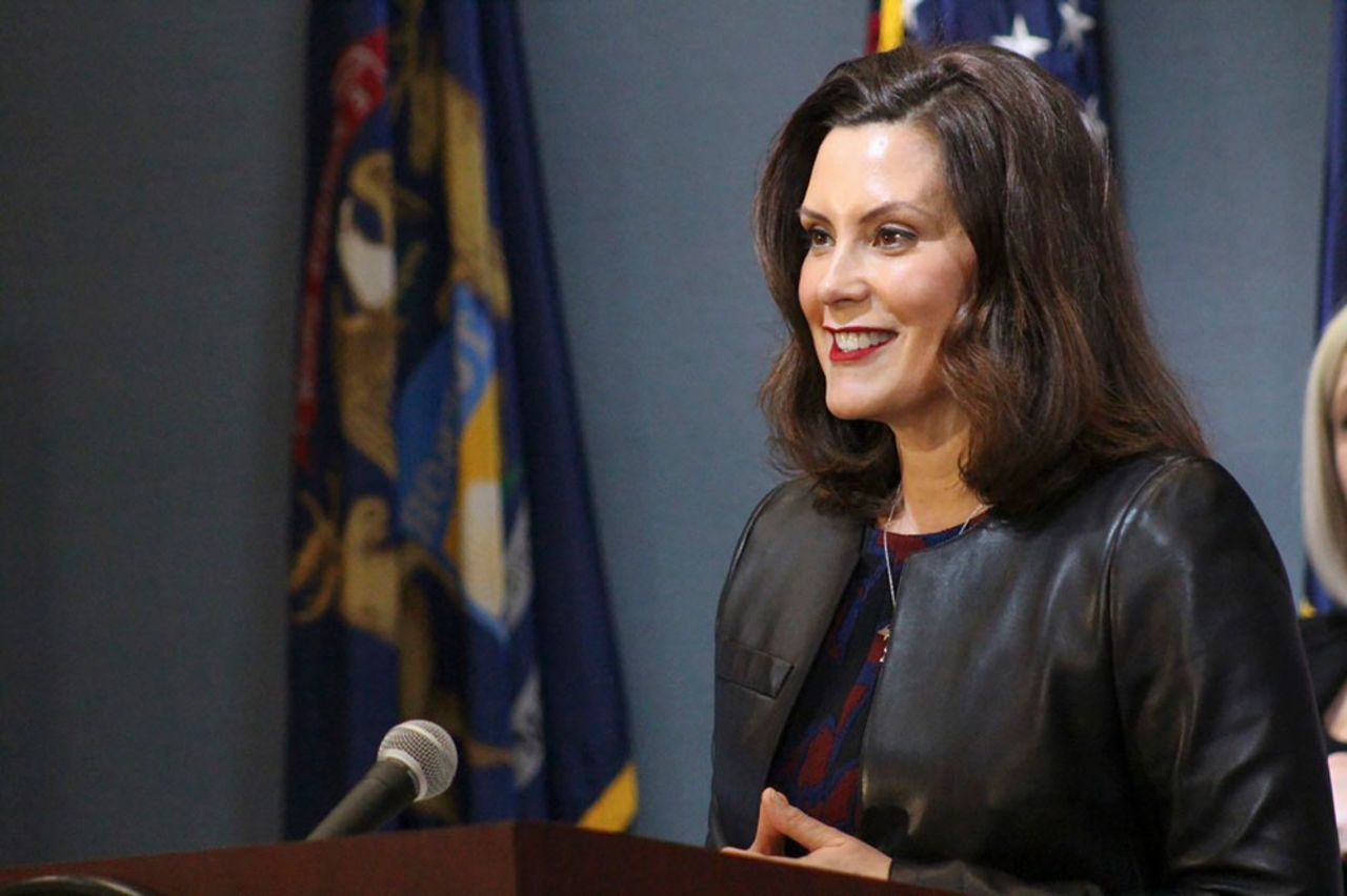 In a pool photo provided by the Michigan Office of the Governor, Michigan Gov. Gretchen Whitmer addresses the state during a speech in Lansing, Michigan, on Friday, May 1. 