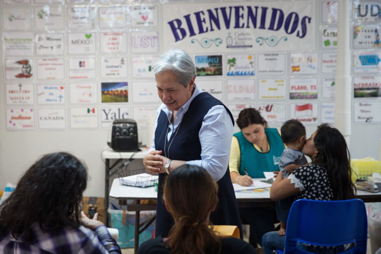 Sister Norma Pimentel, executive director of a Catholic Charities relief center, greets immigrants recently released from detention through 'catch and release' immigration policy at the centre on June 17, 2018 in McAllen, Texas.  