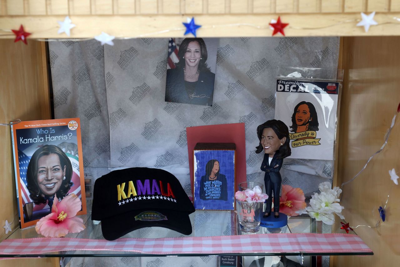 Items depicting Vice President Kamala Harris are displayed in a window at White House Gifts in Washington, DC.