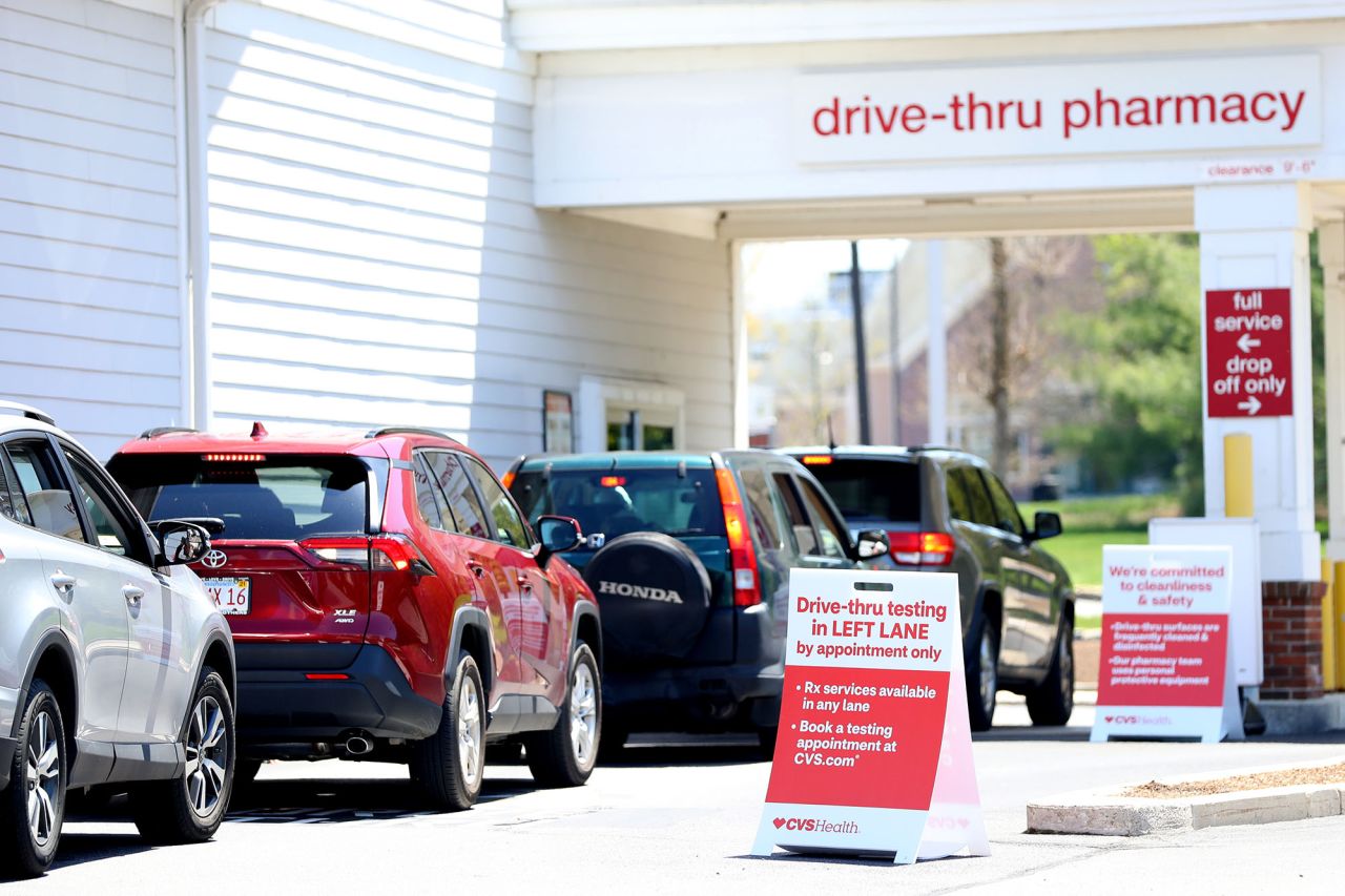 Cars line up for a drive-thru coronavirus test at CVS Pharmacy on May 15, in Carver, Massachusetts.