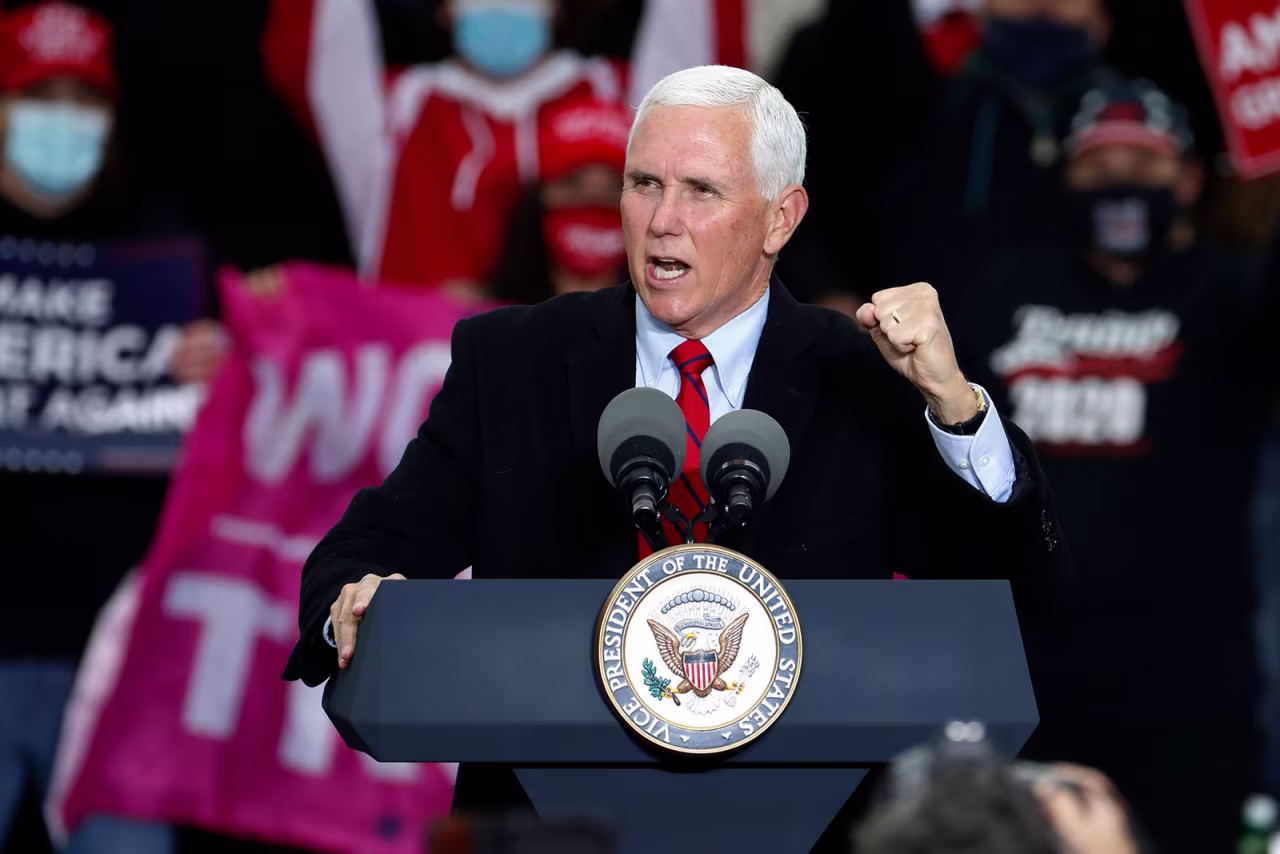 US Vice President Mike Pence speaks during a "Make America Great Again!" campaign event at Oakland County International Airport in Waterford, Michigan, on October 22.