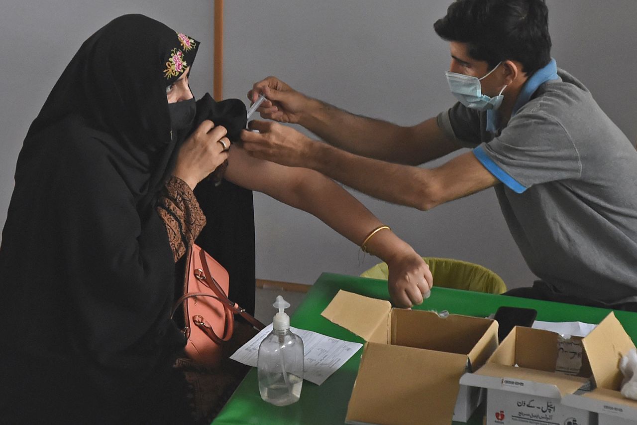 A health worker inoculates a woman with Sinopharm, a coronavirus vaccine, in Lahore, Pakistan on April 28.