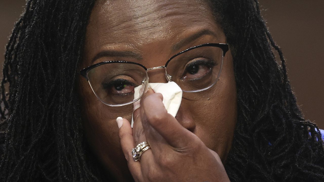 Supreme Court nominee Judge Ketanji Brown Jackson wipes tears from her eyes while listening to Sen. Cory Booker speak during her confirmation hearing on March 23.