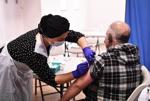 Sonia Akbar prepares to administers the AstraZeneca/Oxford Covid-19 vaccine to a patient at a pop up vaccination centre at the Pakistani Community Centre on April 9 in Derby, England. 