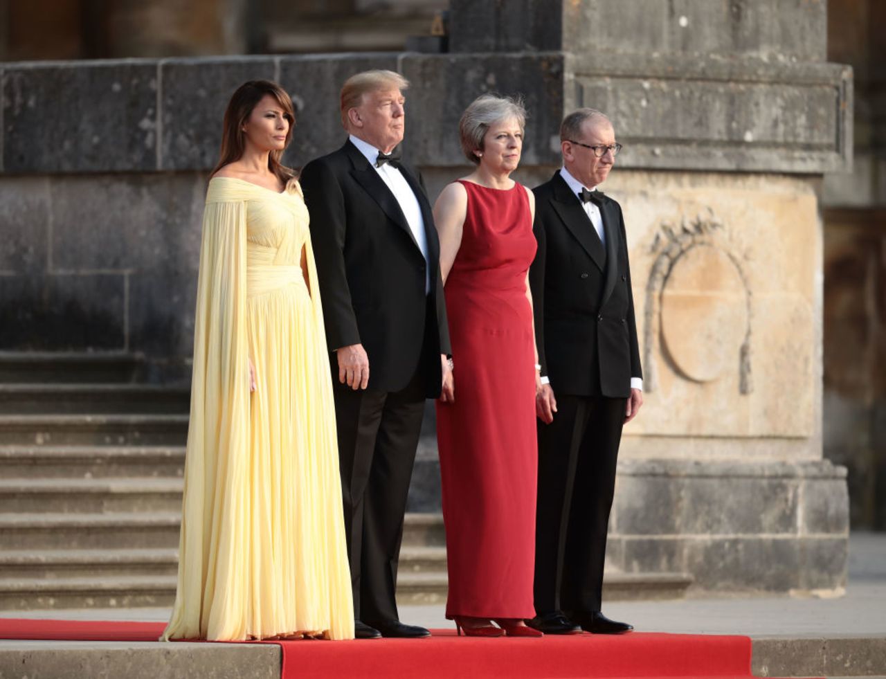 Britain's Prime Minister Theresa May and her husband Philip May greet President Donald Trump and first lady Melania Trump at Blenheim Palace on July 12, 2018.