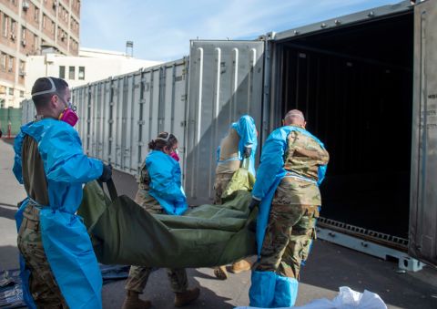 Members of the National Guard assist with processing Covid-19 deaths and placing them into temporary storage at LA County Medical Examiner-Coroner Office in Los Angeles on January 12 in Los Angeles.