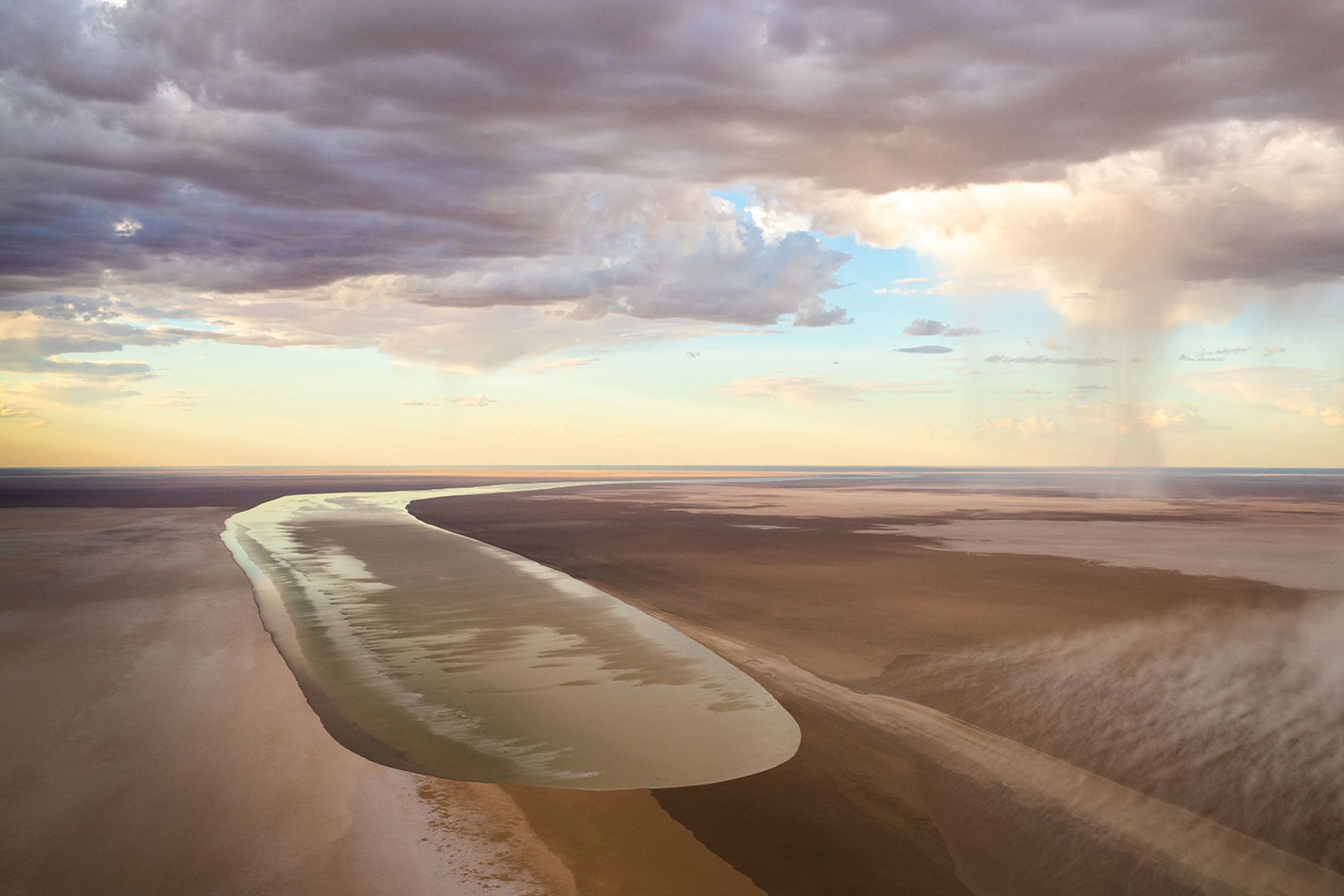 A photo of the Kalamurina Wildlife Sanctuary taken in 2018 shows floodwaters from north-west Queensland flowing into the area, traveling more than 600 miles over two months. A similar event is happening now, on a much bigger scale, and may not take its full effect until October.