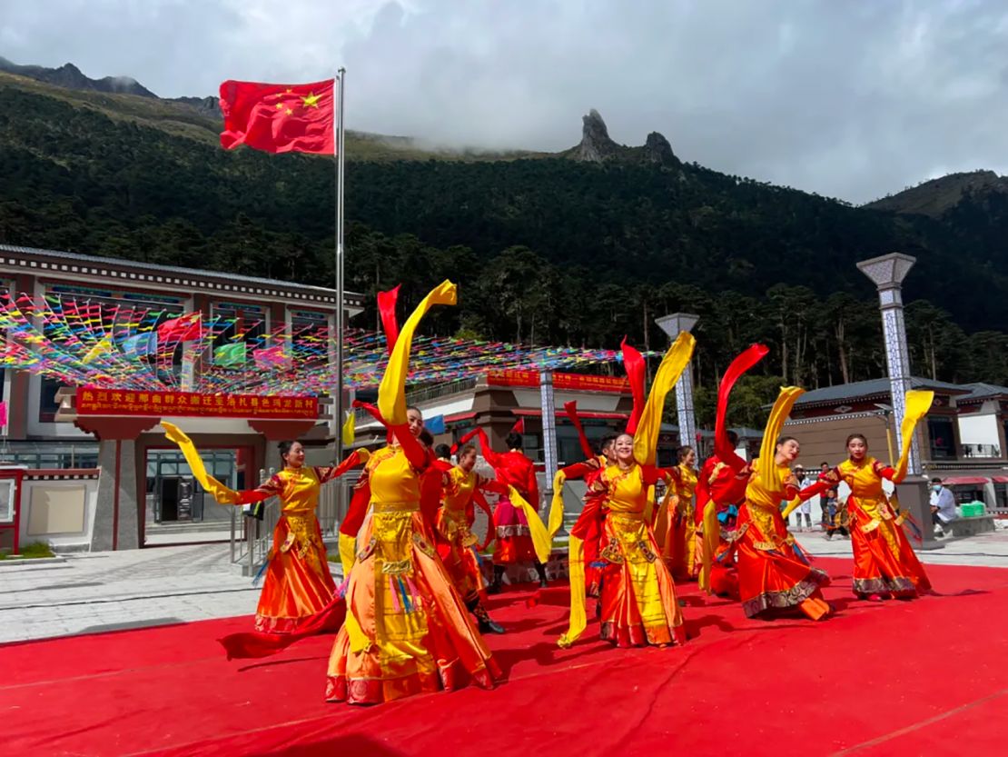 Dancers perform in a welcome ceremony for new residents of Semalong – a Chinese village built on land claimed by both China and Bhutan according to official maps.