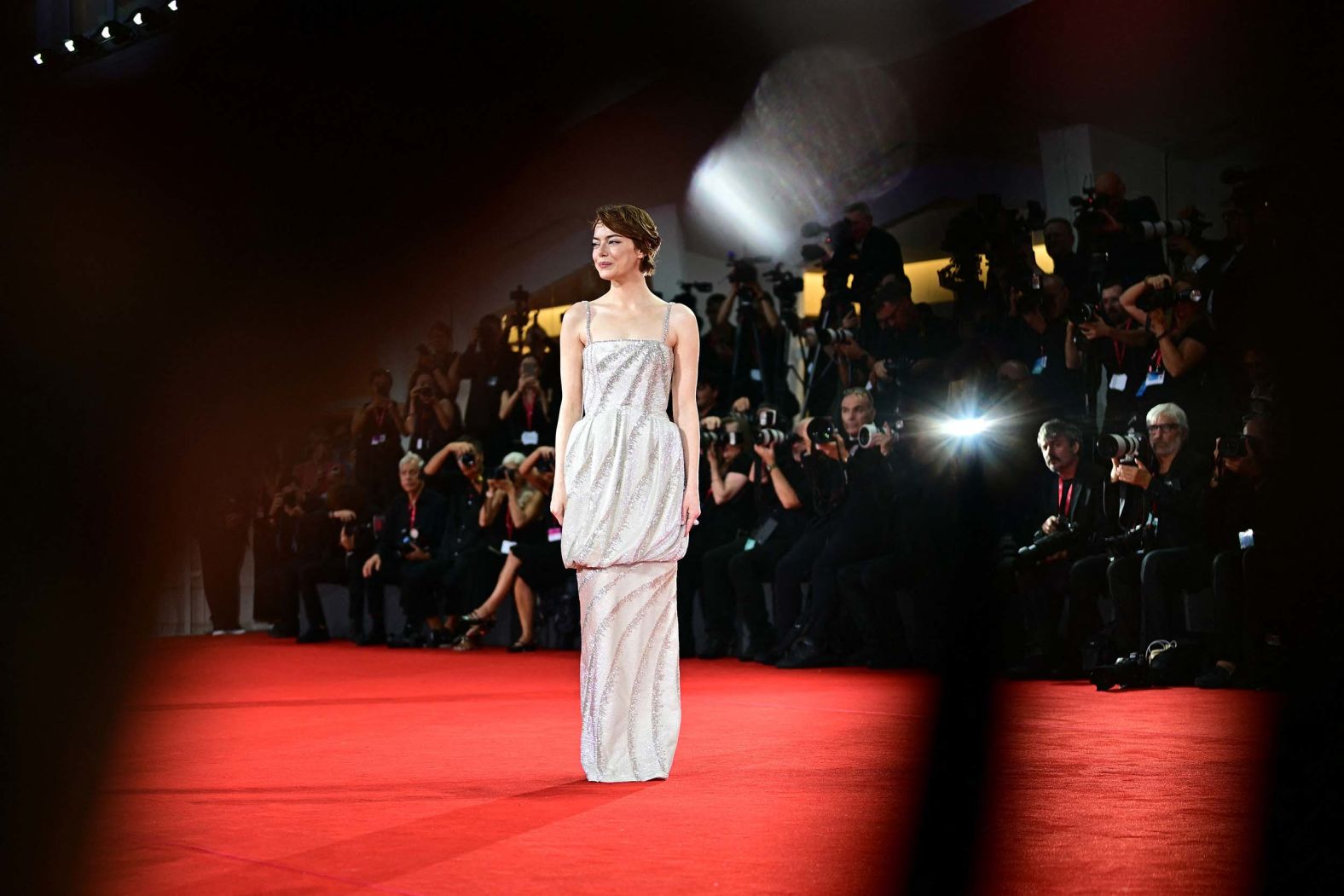 Actress Emma Stone poses on the red carpet before the screening of the movie "Bugonia" at the Venice Film Festival in Italy on Thursday, August 28. <a href="index.php?page=&url=https%3A%2F%2Fwww.cnn.com%2F2025%2F08%2F29%2Fstyle%2Fthe-best-looks-from-venice-film-festival-2025">See the best looks from this year’s festival</a>.