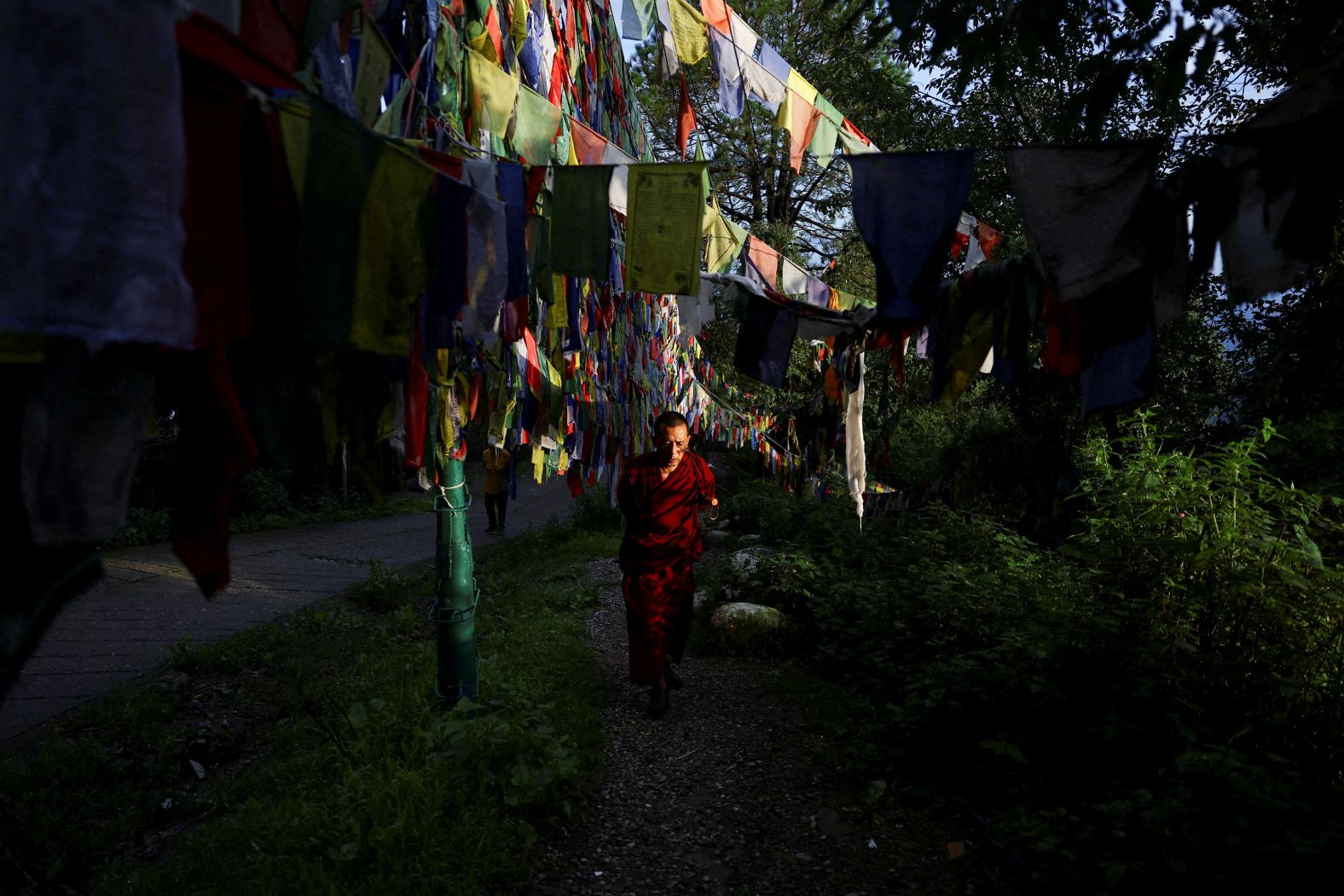 A monk walks around the Tsuglagkhang, the Dalai Lama Temple complex, in Dharamshala, India, on Tuesday, July 1.