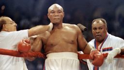 FILE - In this April 20, 1991, file photo, heavyweight challenger George Foreman, center, is tended by veteran trainer Angelo Dundee, left, and former light-heavyweight champion Archie Moore during a title fight against Evander Holyfield in Atlantic City. (AP Photo/Amy Sancetta, File)