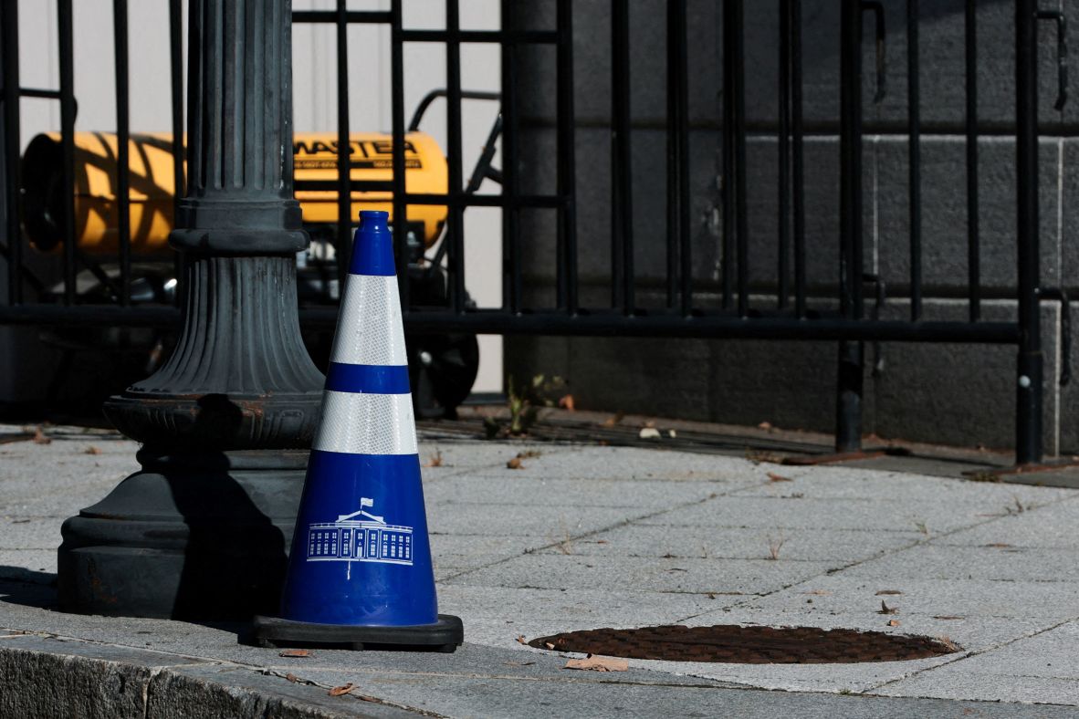 A White House cone stands on the ground near the East Wing on October 21.