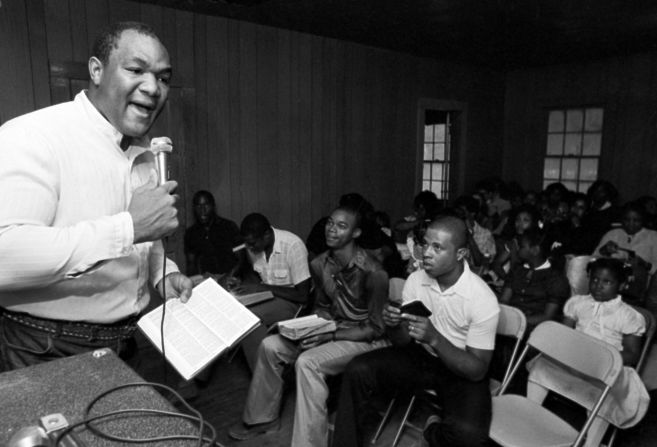 Foreman, who said he had a deeply religious experience following his loss to Young and became a preacher, reads to his congregation during a prayer meeting in Houston in 1981.