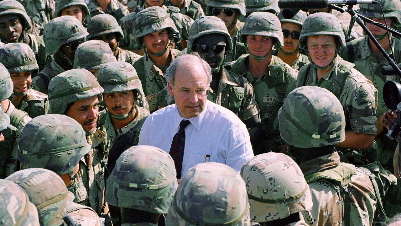 U.S. Defense Secretary Dick Cheney talks with members of the army's 3rd Armored Division in Southern Iraq on Tuesday afternoon, May 7, 1991. Cheney said the troops would be on the move to a different location and he hopes to have them home soon.  (AP Photo/Bill Haber)