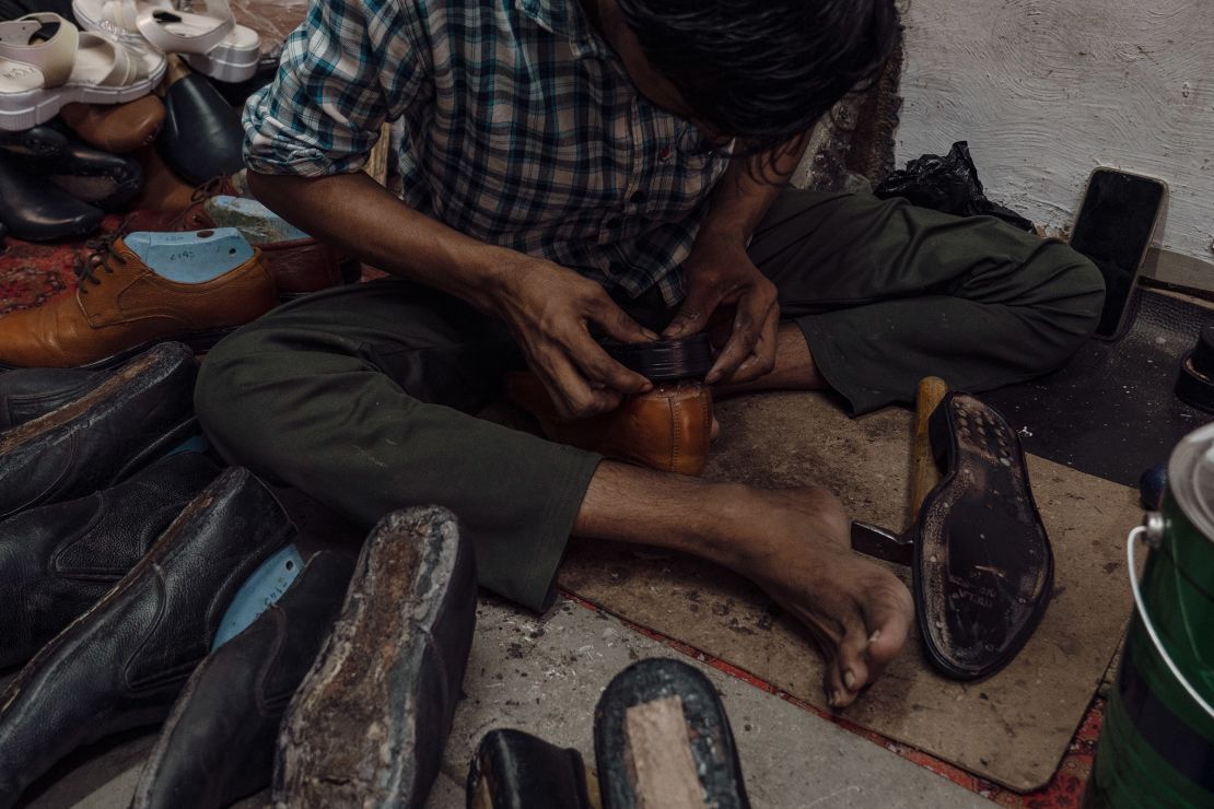 A man works at Shaikh’s workshop in Dharavi slum on April 14.