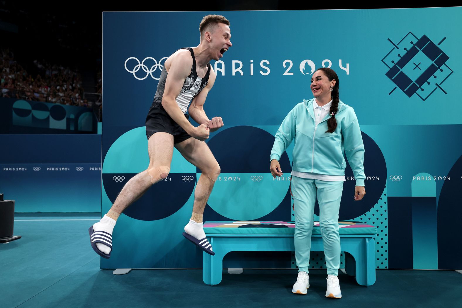 <a >Ivan Litvinovich</a> celebrates winning the gold medal in the men's trampoline on August 2. Litvinovich, who is from Belarus, became the first <a >individual neutral athlete</a> to win a gold medal at the Paris Games.