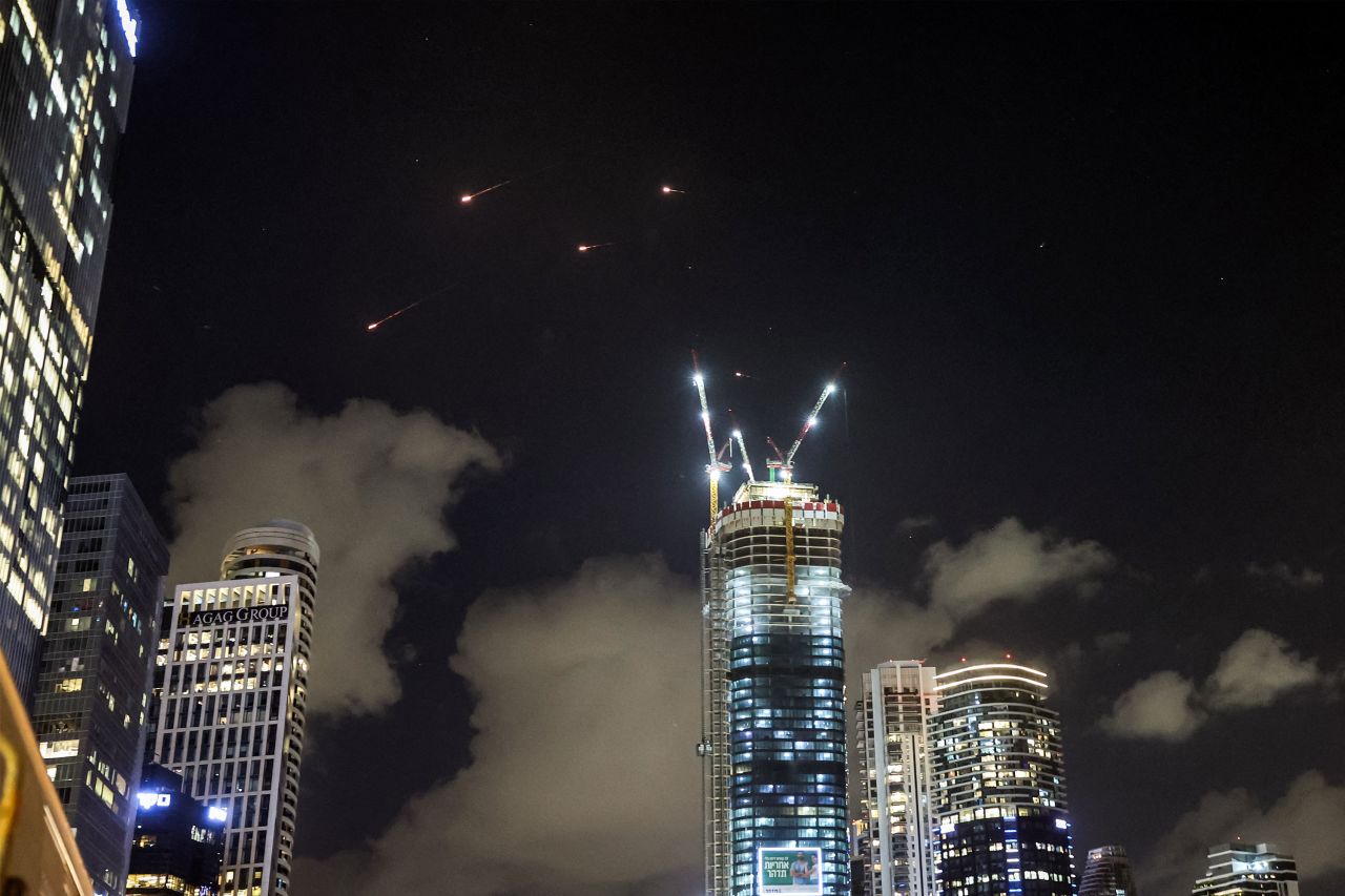 Projectiles are seen being intercepted by Israel above Tel Aviv.