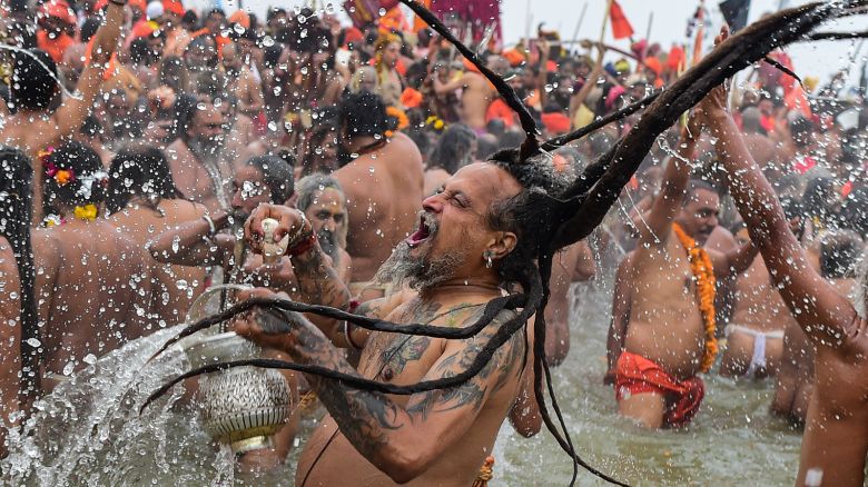 Naga Sadhus take a holy dip at Sangam, confluence of Ganges, Yamuna and mythological Saraswati rivers on the occasion of 'Makar Sankranti' the first royal bathing day of Kumbh Mela on January 14, 2025 in Allahabad, India. Kumbh Mela in 2025 is a Maha Kumbh, which is a significant Hindu festival celebrated once every 144 years at Prayagraj (Allahabad).