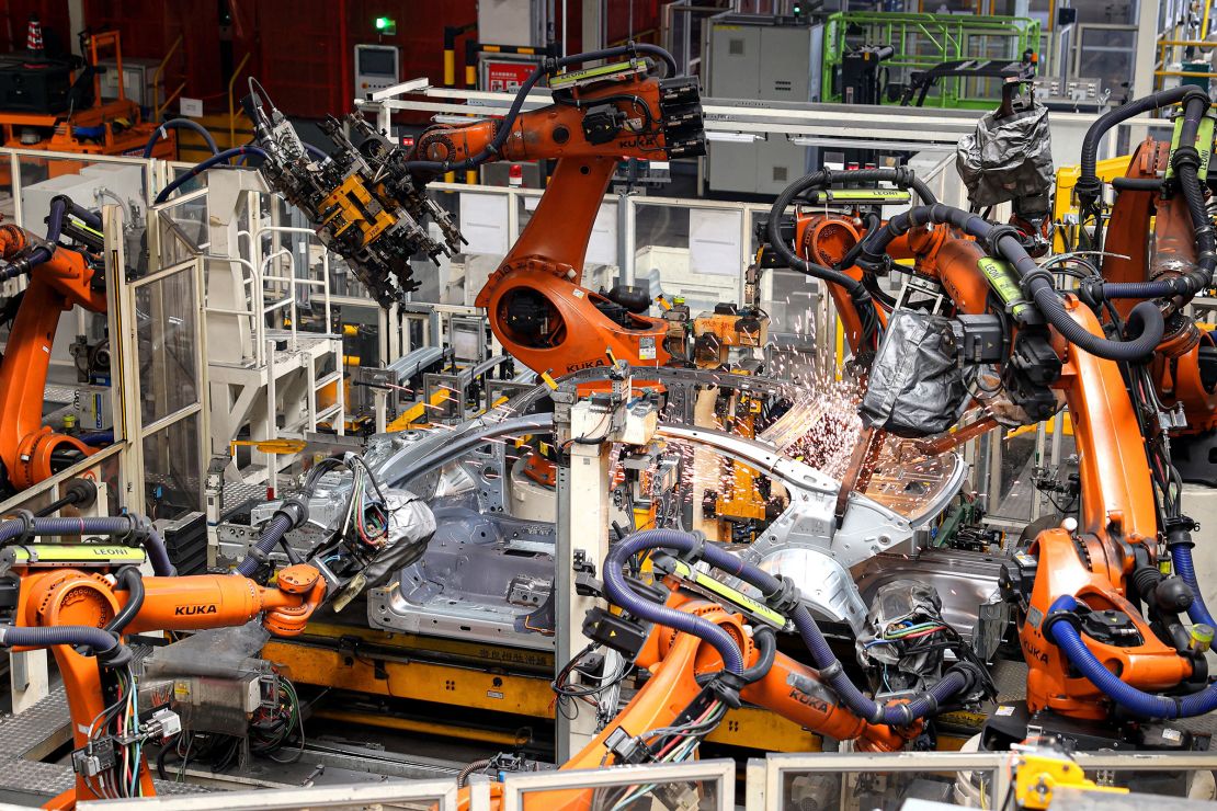 Robot arms work on a car production line at an FAW-Volkswagen factory in the coastal Chinese city of Qingdao in March.