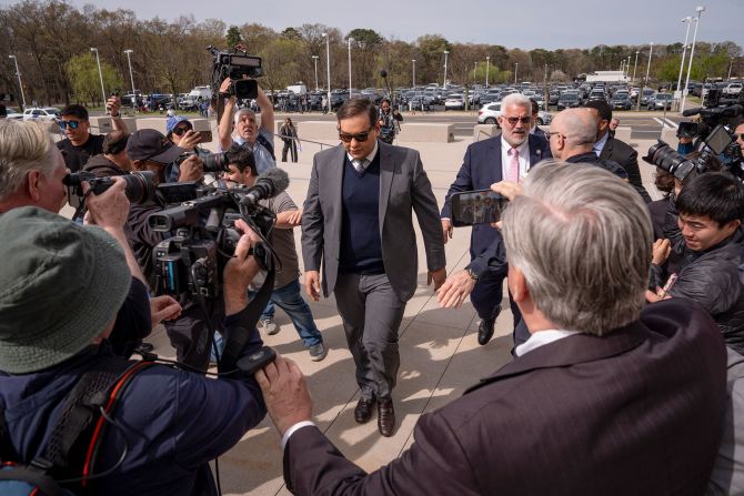 Former US Rep. George Santos arrives at federal court in Central Islip, New York, on Friday, April 25. <a  target="_top" href="/newspapers?url=https://www.cnn.com/2025/04/25/politics/george-santos-sentencing-fraud/index.html">Santos was sentenced to 87 months in prison</a> for aggravated identity theft and wire fraud charges stemming from fraudulent activity during his 2022 midterm campaign.