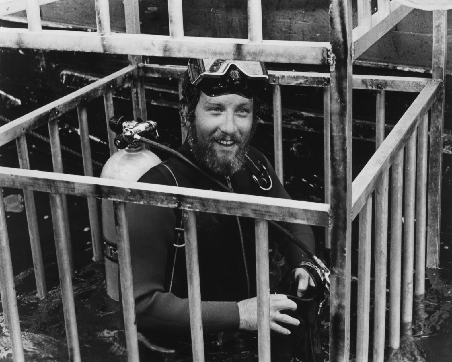 Richard Dreyfuss smiles from the diving cage where his character, shark researcher Matt Hooper, gets up close with the toothy villain. To make that scene feel more real, the crew <a href="index.php?page=&url=https%3A%2F%2Fwww.cnn.com%2F2015%2F06%2F05%2Fentertainment%2Fjaws-movie-40th-anniversary-feat">shot</a> real footage of sharks from a cage in Australia.