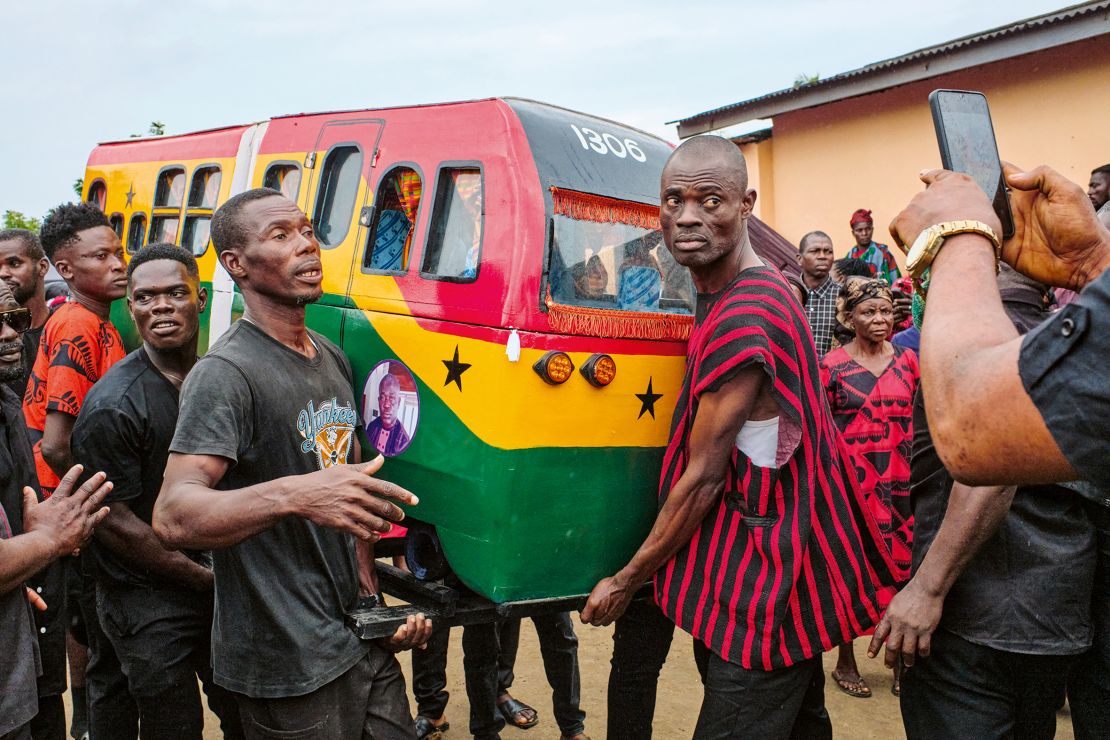 A coffin shaped like the carriage of a railway locomotive — a tradition of deceased employees of the Ghana Railway Company, according to Tschumi. Central Region, 2023.