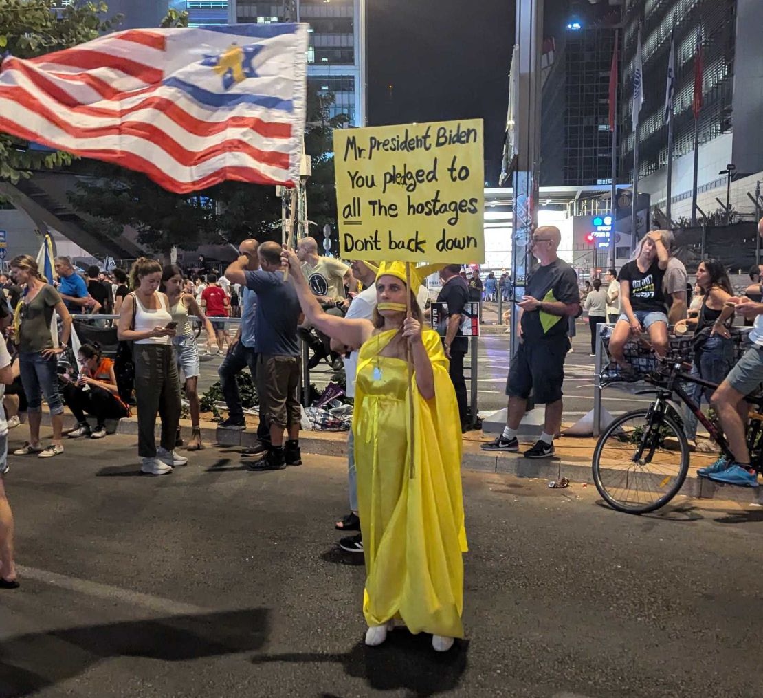 A protester in Tel Aviv on September 7 calls for a hostage deal.