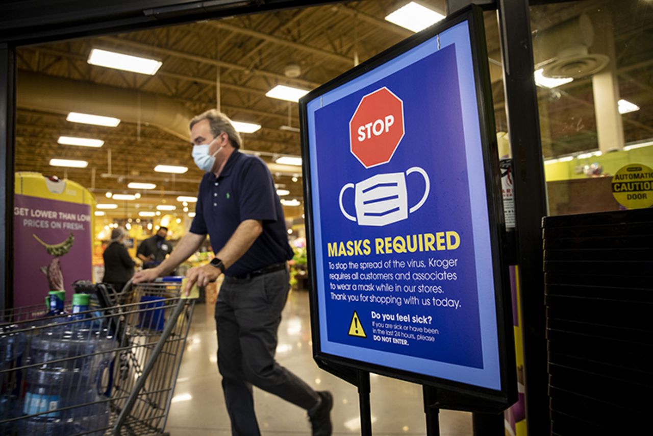 A "Mask Required" sign at the entrance to a Kroger Co. grocery store in Houston, Texas,  on Wednesday, March 10.