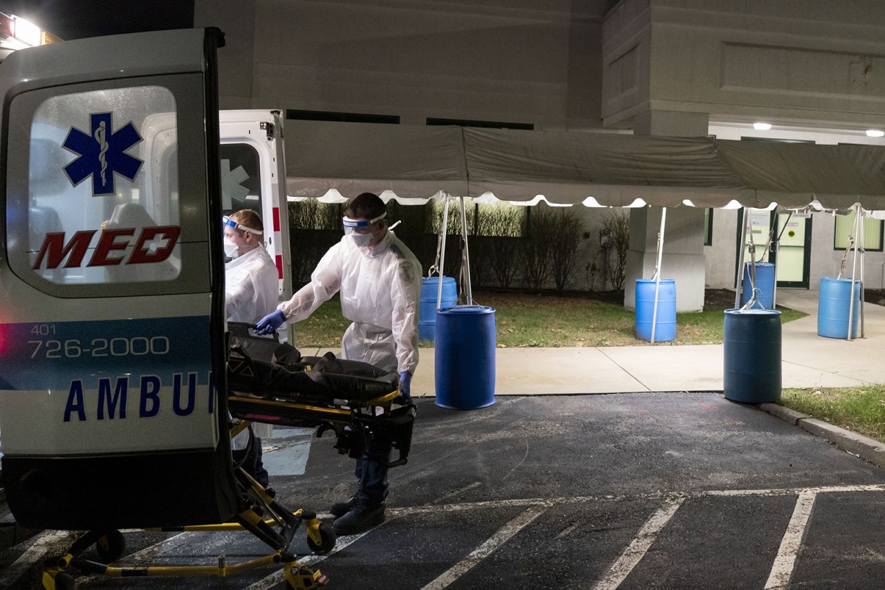 A stretcher is loaded back into an ambulance after EMTs dropped off a patient at a newly opened field hospital operated by Care New England to handle a surge of Covid-19 patients in Cranston, Rhode Island, on Tuesday, Dec. 1.