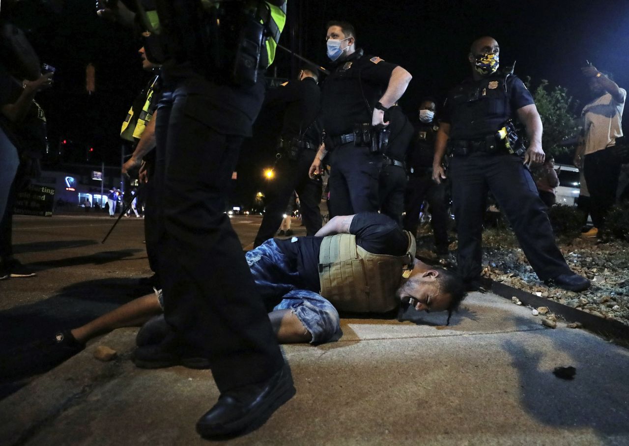 A person winces in pain after being pepper sprayed by police during a protest in Memphis, Tennessee, on May 28.