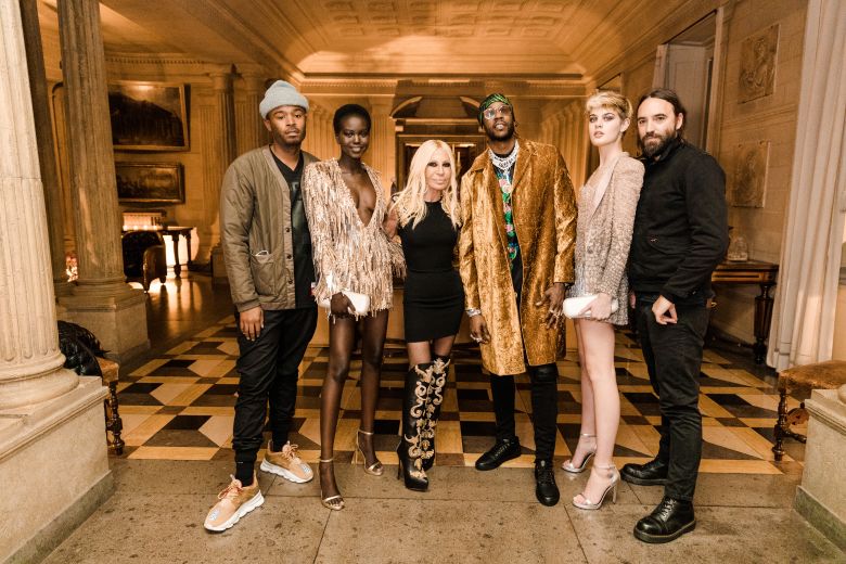 Bembury (left) poses alongside his boss Donatella Versace (center) during his time at the company.