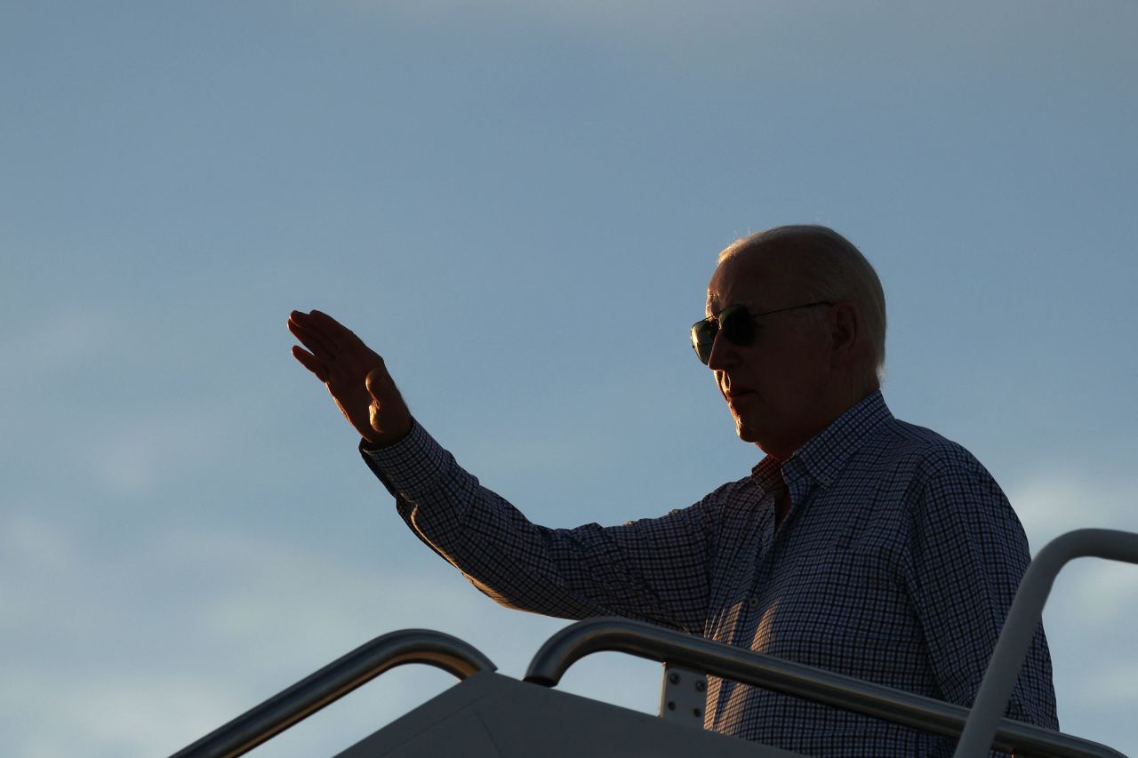 President Joe Biden gestures as he boards Air Force One at Dover Air Force Base in Delaware, June 20, on his way to Camp David in Maryland.
