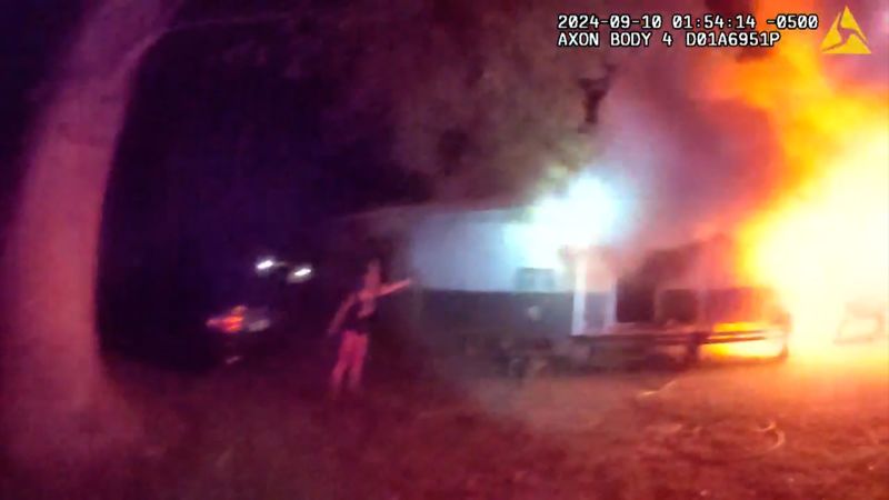 Two children were trapped in a burning house. Watch how police responded