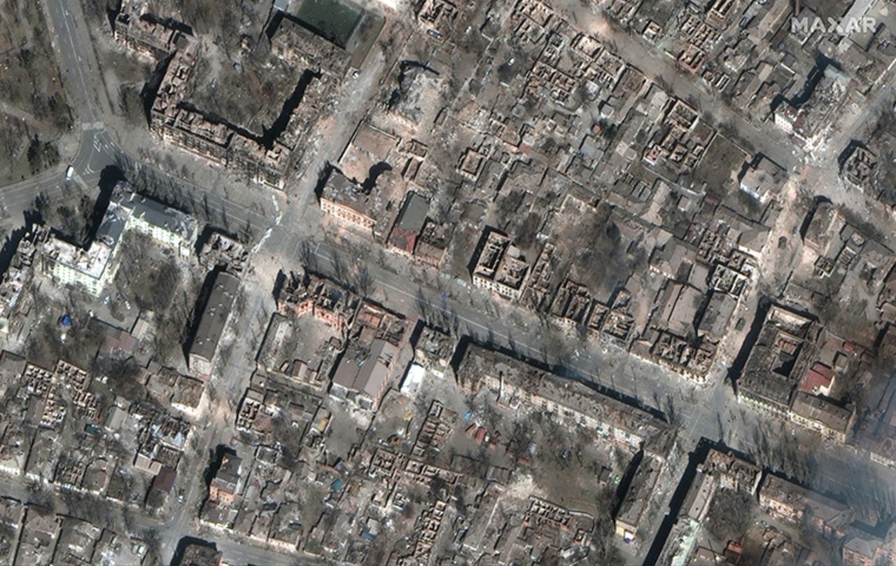 A satellite photo shows entire city blocks destroyed in central Mariupol.